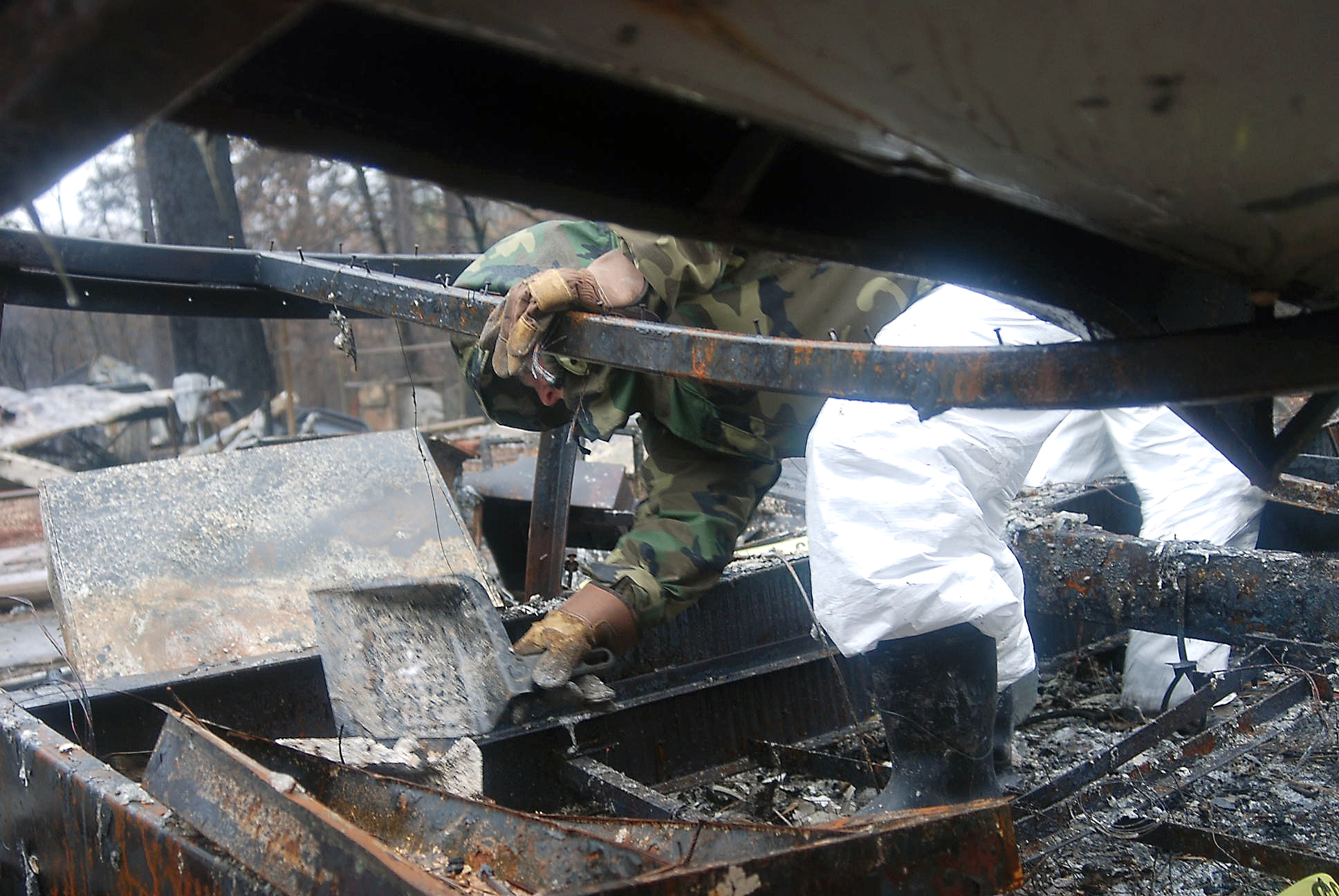 Sacramento District's Hope Schear works around burned debris while helping search for cremains at the site of the Camp Fire in Paradise, California, in February 2019.